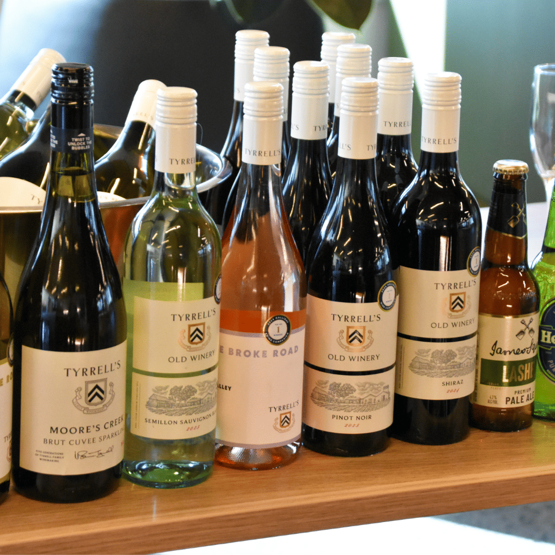 Corporate event bar setup with wine and beer bottles