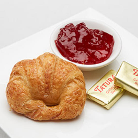 Croissant Served with Butter and Preserves