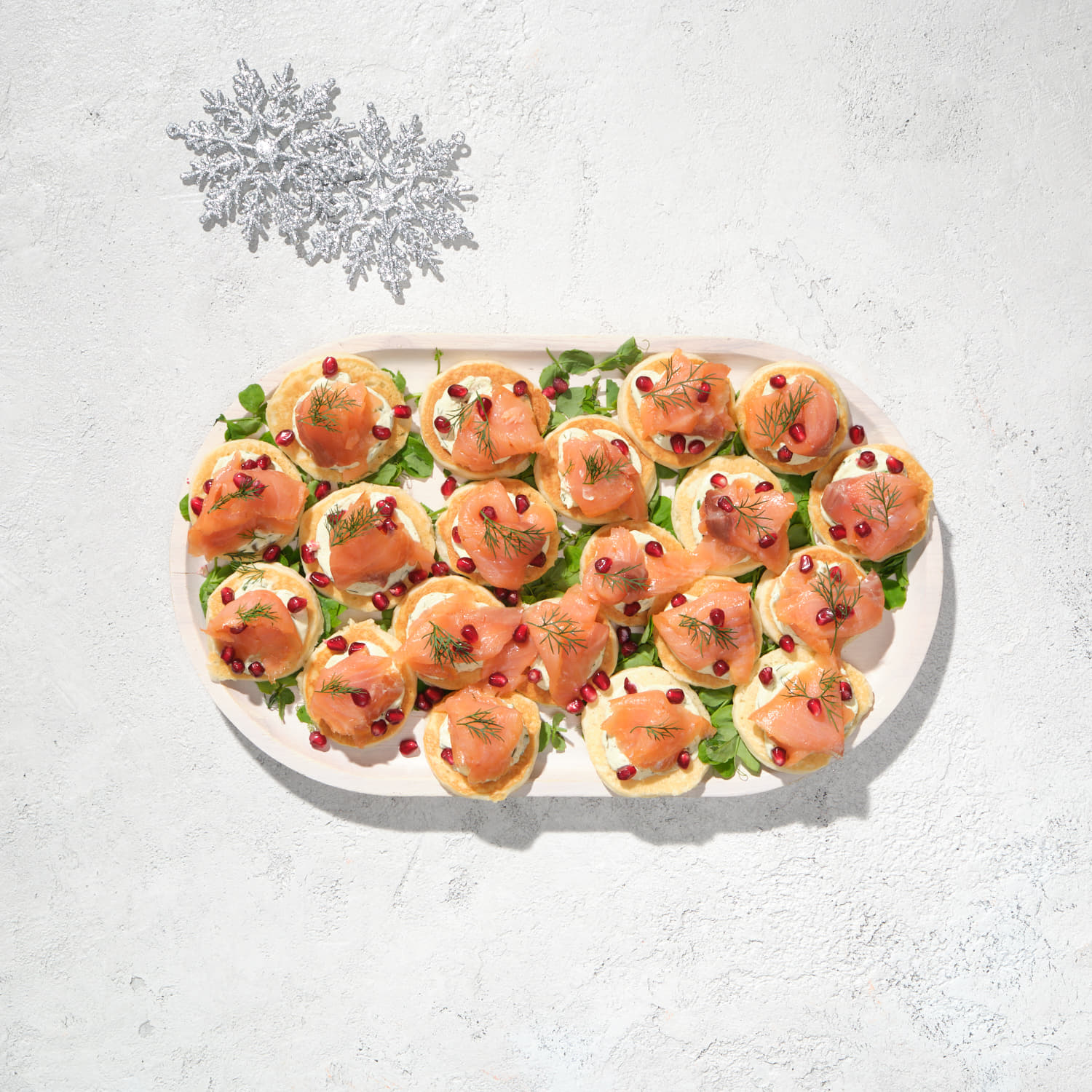 Canapé - Smoked Salmon Blinis, Pomegranate, Creme Fraiche + Lemon Caper Dill