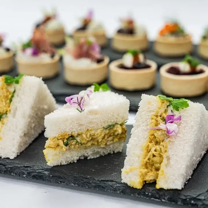 Coronation Chicken Mini Sandwich, Mango Compote, Baby Herbs, Mild Curry Mayonnaise