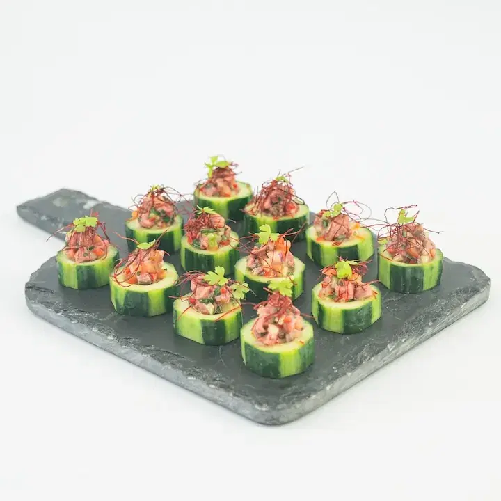Beef Eye Fillet Salad Bites on Cucumber Rounds with Finger Lime, Kaffir Lime, Chilli Thread & Baby Herbs